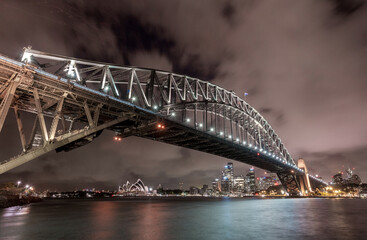 Sydney Harbour Bridge and Opera House at Night. Beautiful Sydney Cityscape and Skyline. Long Exposure. Flowing Sky. Australia
