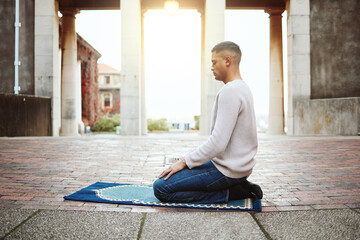 Muslim, faith and praying with an islamic man prayer to god on a carpet for eid or ramadan while...