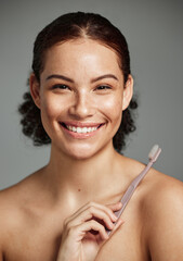 Brushing teeth, toothbrush and a woman portrait while happy about dental hygiene and teeth whitening. Face of a female with a smile for oral health, healthy mouth and self care on studio background