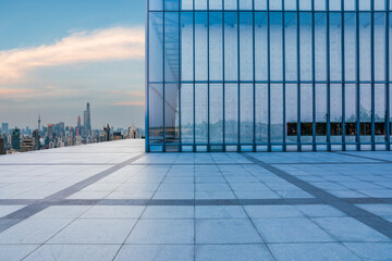 Empty floor and glass wall with city skyline in Shanghai, China.