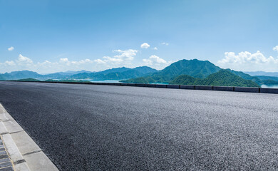 Asphalt road and green mountain nature background