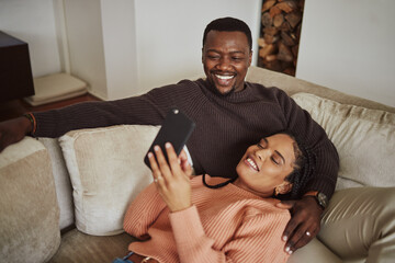 Black couple, phone and funny social media post while together on living room couch with home wifi...