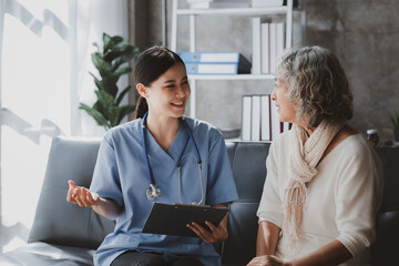 Doctors are talking to explain medication and health care to elderly patients, elderly people with...