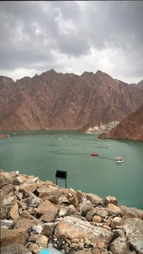 Hatta Dam in UAE, boats floating in dam 