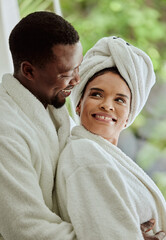Spa, love and relax with a black couple in a health center or luxury resort for romance and wellness. Vitality, rest and relaxation with a man and woman at a lodge for a romantic weekend getaway