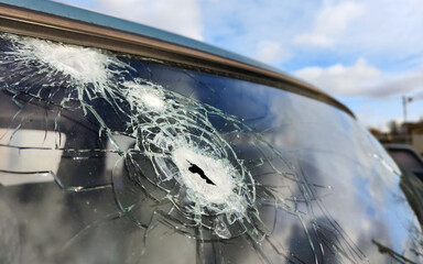 Russian missile attack on civilian infrastructure facilities in the center Kherson city. Damaged car