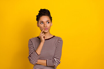 Portrait of minded young lady finger touch chin pouted lips look empty space contemplate isolated...