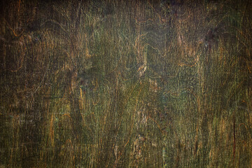 Old wooden brown background. The surface of the old table is brown with a green shade made of natural wood with a place to place the product.