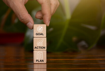Hand picked cubes have a plan for messages, goals, and actions. Concept of business growth, profit and development for success in 2023.