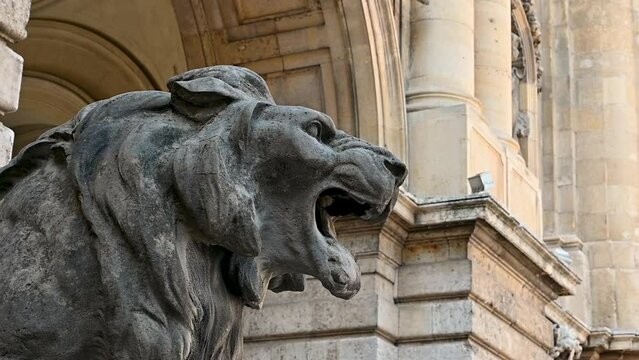 Budapest, Hungary, August 2022. Footage with the detail of one of the lion states roaring in the courtyard of the castle of buda, on the hill.