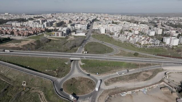 Altamura, Italy skyline with highway and traffic with drone video moving forward.