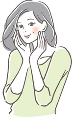 頬に手を当て気持ちよく目を閉じるシニア女性