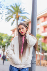 Beauty transgender woman in colorful wall looking at camera