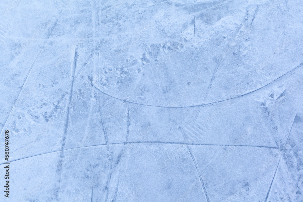 Poster empty ice rink with skate marks after the session outdoor. skating ice rink texture covered with sno