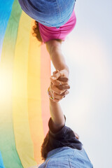 LGBTQ community, rainbow flag and couple holding hands for human rights protest, solidarity and gay...