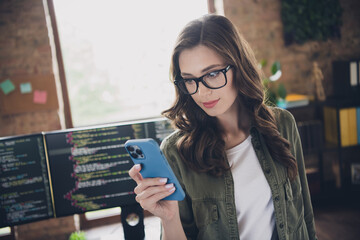 Photo of serious confident clever lady use telephone read proposition create new program...