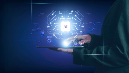 Artificial intelligence of futuristic technology concept. Hand using a finger touch on tablet screen show virtual circuit AI brain genius technology link to big data network and analytic information.