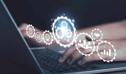 Operation management Business process control optimisation industrial technology and workflow concept. Problem solving, High performance, quality control. Hand using laptop with virtual gears icons .