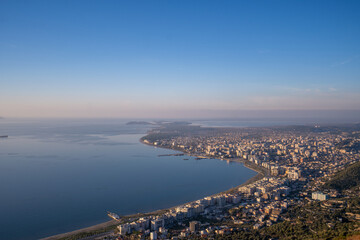 Fototapeta premium Attractive spring cityscape of Vlore city from Kanines fortress. Captivating morning sescape of Adriatic sea. Spectacular outdoor scene of Albania, Europe. Traveling concept background.