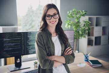 Photo of confident smiling lady admin wear spectacles arms folded creating new application indoors workplace workshop