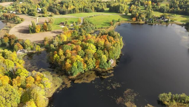 Many small islands aerial drone view. Summer vacation place. Autumnal view. Flat landscape. Small green islands with forest inside the lake. Green summer landscape. Autumnal view.