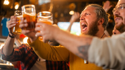 Excited Soccer Club Members Cheering for Their Team in a Pub. Supportive Fans Standing in a Bar, Cheering, Raising Hands and Shouting. Friends Celebrate Victory After the Goal.