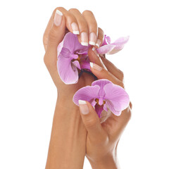 Woman hands, beauty and orchid flower with manicure nails after spa or beauty salon treatment in studio. Body of female model for floral background, health and wellness with natural cosmetics