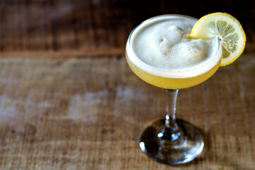 Whiskey sour cocktail, foam pictured from the top