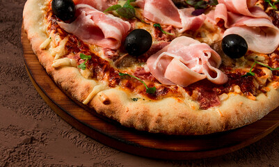 Pizza with prosciutto and mushrooms, bacon, olives, homemade, top view, no people,