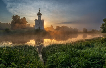 Sunrise on the Nerl River , the Church of the Intercession, built in the 12th century, historical...