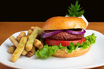 plant base burger with a side of broccoli fries