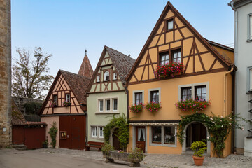 Fototapeta na wymiar Picturesque little colored half-timbered houses in the medieval town of Rothenburg ob der Tauber.