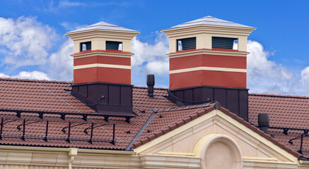 house with a roof from a burgundy shingles with a pipe