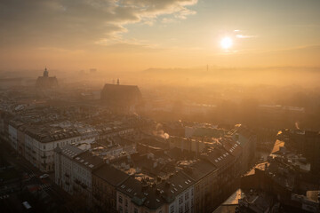 Foggy sunrise over the old town in Krakow. Poland