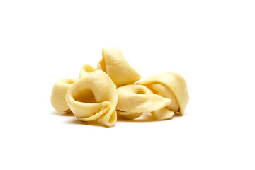 Tortellini stuffed pasta isolated on white background, closeup. Tortellini with raw prosciutto. Italian food