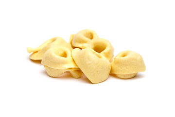 Tortellini stuffed pasta isolated on white background, closeup. Tortellini with raw prosciutto. Italian food