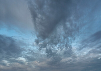 Dark, altocumulus clouds against bright, blue sky. - obrazy, fototapety, plakaty