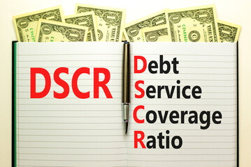 DSCR debt service coverage ratio symbol. Concept words DSCR debt service coverage ratio on white note on beautiful white background. Business DSCR debt service coverage ratio concept. Copy space.