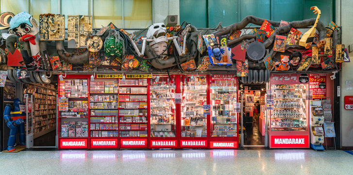 tokyo, japan - august 06 2022: Panorama view of the facade of Mandarake store specialize in manga and anime-related with shelves full of used comics books in the Nakano Broadway Shopping Mall.
