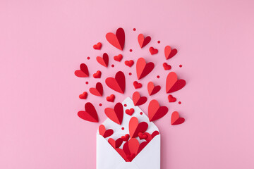 Valentine day background with envelope and various red hearts. Flat lay love and romantic composition.. - obrazy, fototapety, plakaty