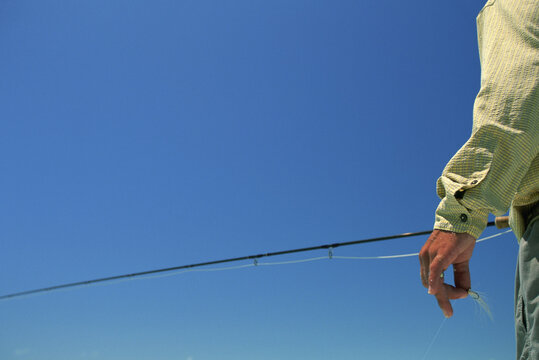 An anonymous fly-fisherman ready to fish in the Bahamas.