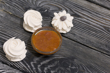 Obraz na płótnie Canvas Homemade marshmallow. Apricot jam. On black boards. Close-up.