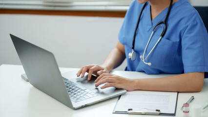 Doctor with tablet in medical office. Visiting Physician online concept