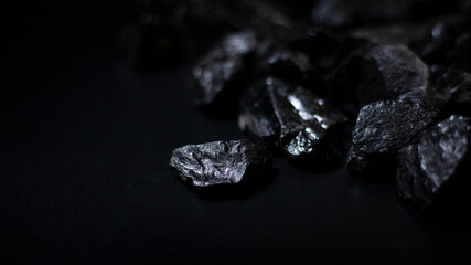 A heap of black natural coal, photo of coal mine background, texture	