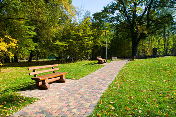 City park with benches, path and lawn.