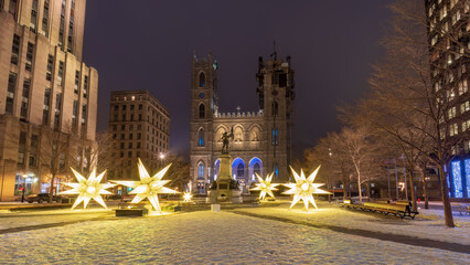 Fototapeta na wymiar Montreal, winter decorations of the Place d'Armes in front of Notre-Dame Cathedral,
