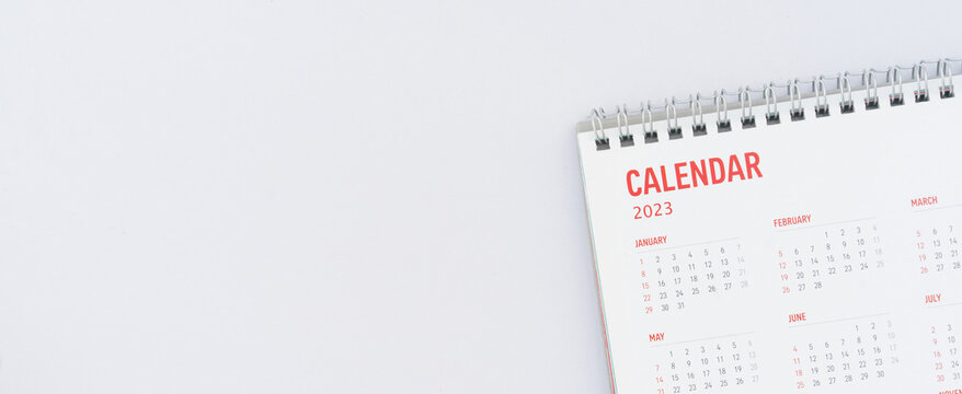 close up top view on calendar month schedule to make appointment meeting or manage timetable each day lay on white background for planning work and life concept	