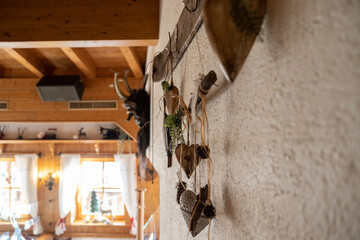 Wall in a cozy wooden ski hut decorated with handicrafts, Austria, Salzburg