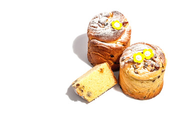 Easter cake Cruffin or sweet bread kulich and traditional painted eggs. Baking and cherry flowers