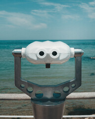 coin operated binoculars on the beach
